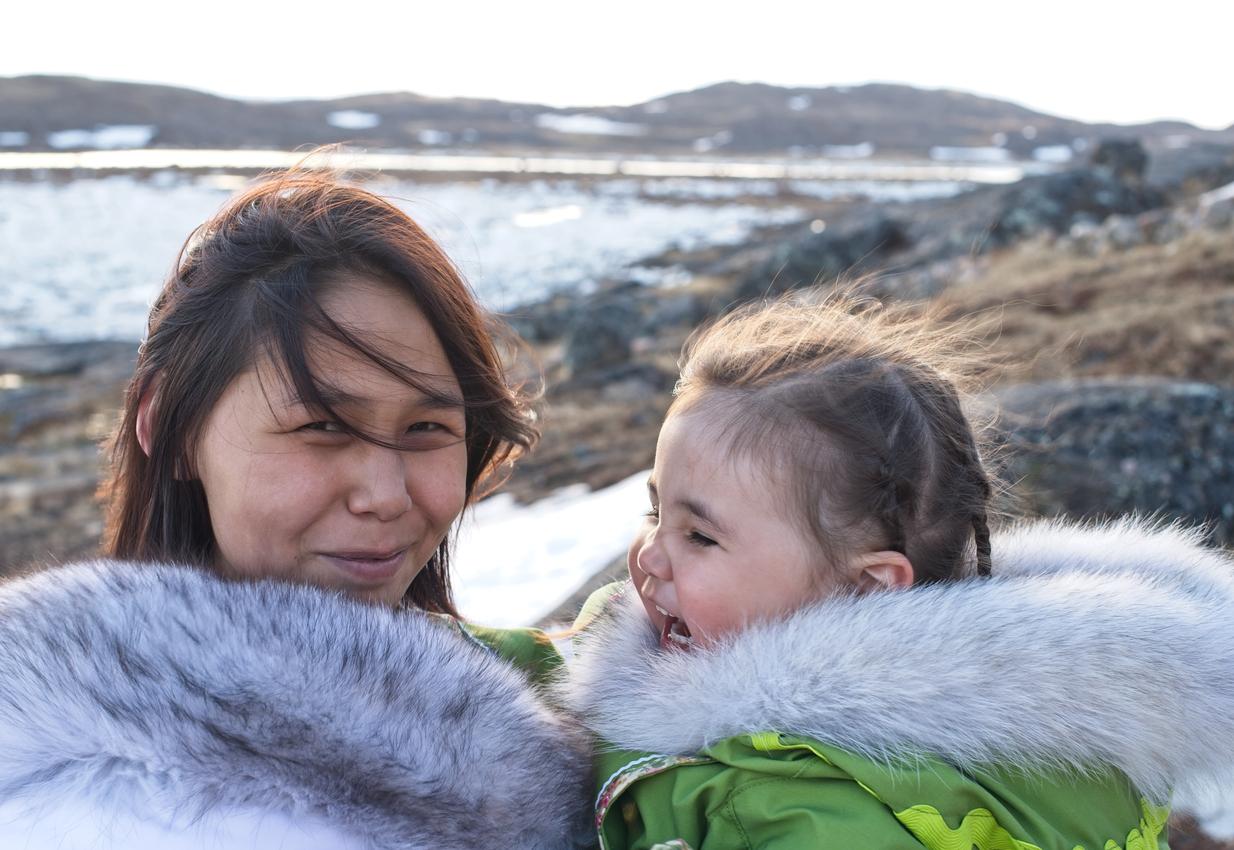 Intuit mother holding a daughter